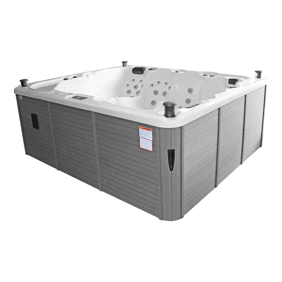 Een vrijstaand rechthoekige jacuzzi met grijze omkasting en een witte kuip, gezien vanaf de zijkant.