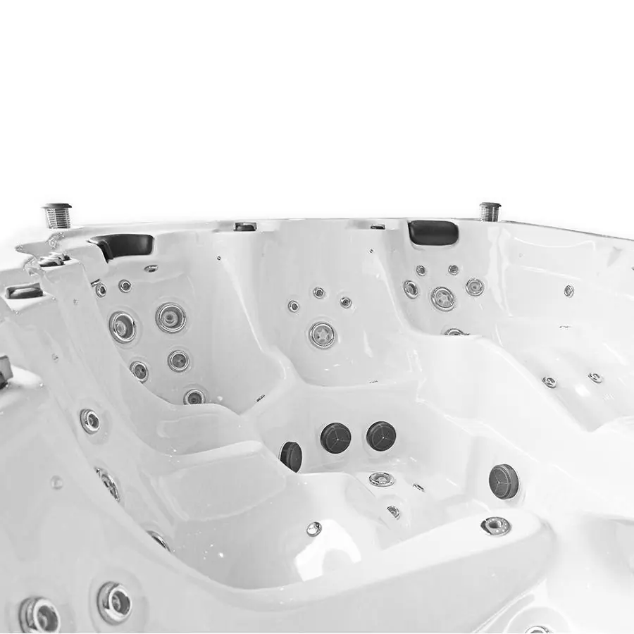 Binnenaanzicht van een witte spa met meerdere zitplaatsen, ergonomische vormen en diverse massagejets op verschillende hoogtes.